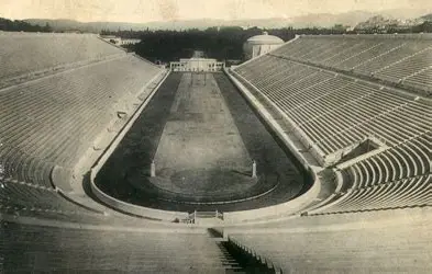 A wide-angle view of the Panathenaic Stadium in Athens, preferably empty or with tourists.