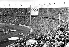 A wide-angle view of the Panathenaic Stadium in Athens, preferably empty or with tourists.